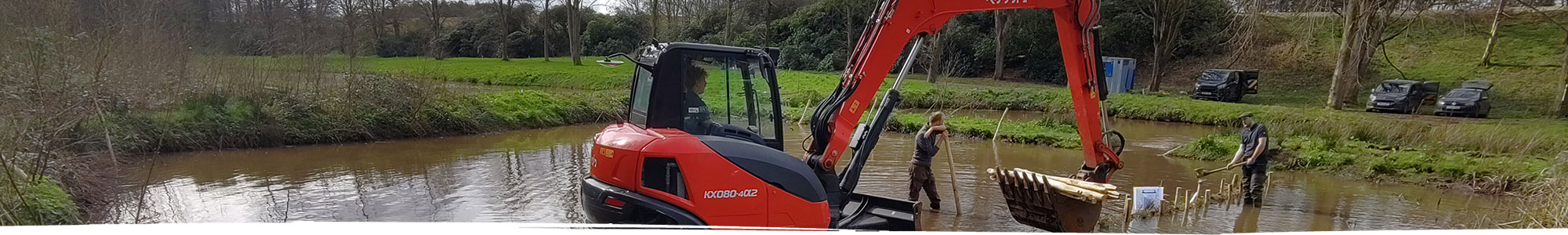 Digger doing pond clearance