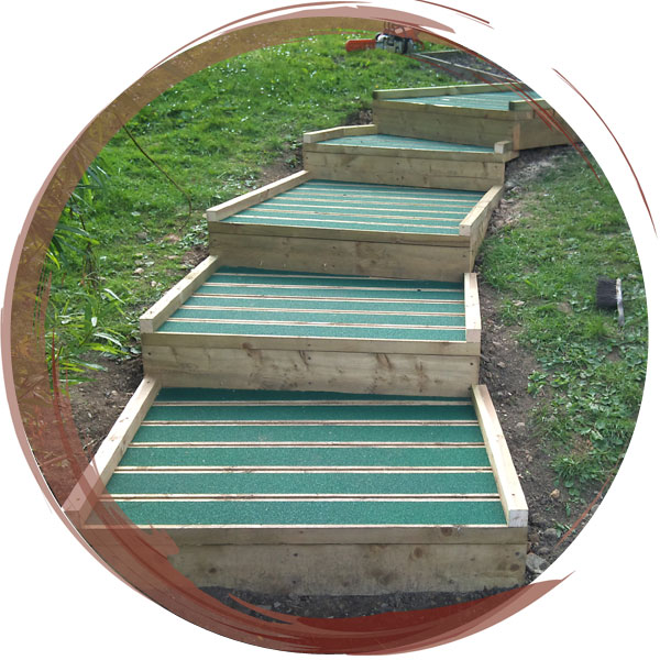 A flight of timber steps topped with green non-slip tape to allow safe use in all conditions