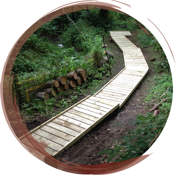 New boardwalk installed through woodland Nature Trail to secret classroom by the stream. Borderbrook Primary School, Wrexham