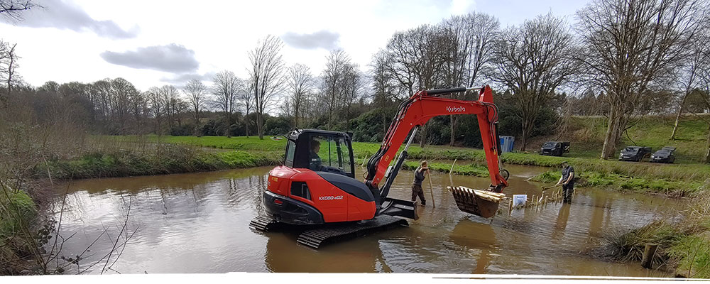 Digger doing pond clearance