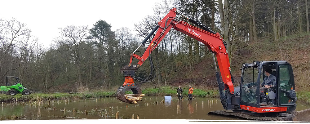Pond clearance using digger